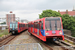 Bombardier DLR B07 Stock n°126 et Bombardier DLR B92 Stock n°57 sur le DLR (TfL) à Londres (London)